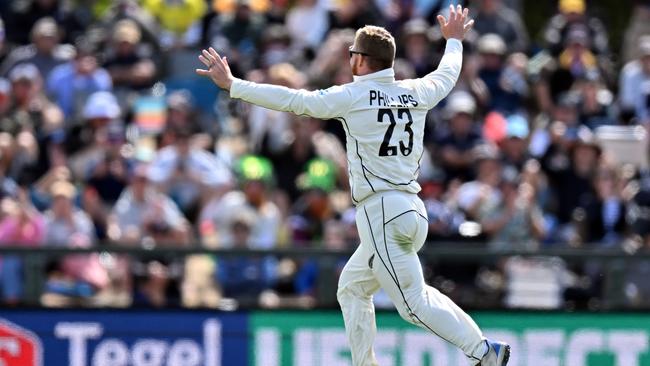 Glenn Phillips of New Zealand celebrates dismissing Carey.