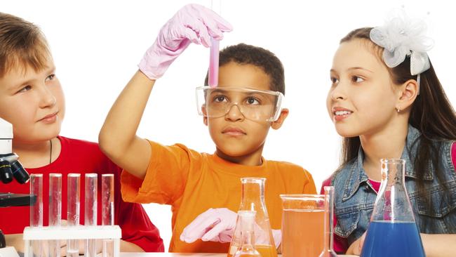 Chemistry class. School children in science laboratory