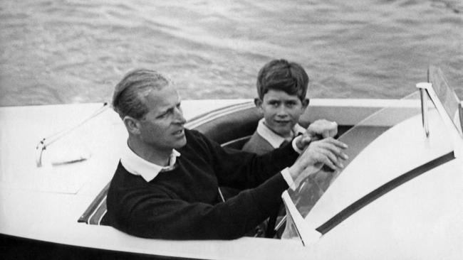 Princes Philip and Charles enjoy some boating. Picture: AFP