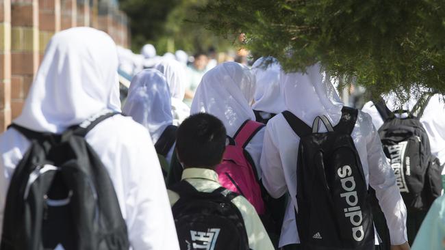 Students leave the Malek Fahd Islamic School on Waterloo Road in Greenacre.