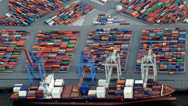 A container ship is loaded at a terminal in the harbour of Hamburg, Germany. Picture: Reuters