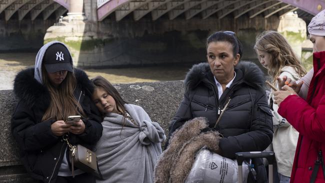 Visitors joined at all hours through the night, bundled in scarves, hats and heavy coats, as the temperature dipped to roughly 40 degrees Fahrenheit and wind whipped off the Thames.