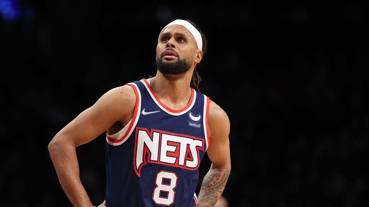 NEW YORK, NEW YORK - JANUARY 03: Patty Mills #8 of the Brooklyn Nets reacts after he is called for a foul in the first half against the Memphis Grizzlies at Barclays Center on January 03, 2022 in the Brooklyn borough of New York City. NOTE TO USER: User expressly acknowledges and agrees that, by downloading and or using this photograph, User is consenting to the terms and conditions of the Getty Images License Agreement. (Photo by Elsa/Getty Images)