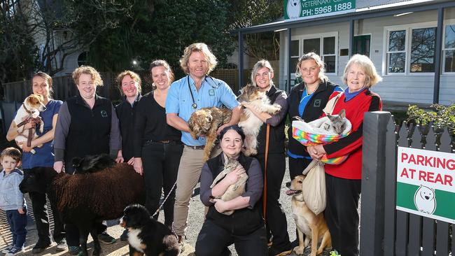 Tom and Kathy Cook with their team. Picture: Ian Currie