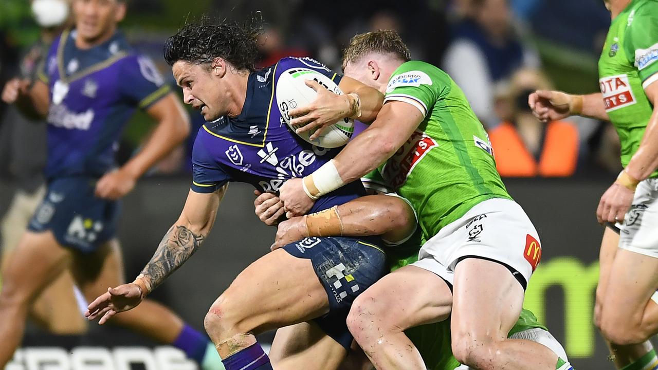 SUNSHINE COAST, AUSTRALIA - AUGUST 12: Nicho Hynes of the Storm takes on the Raiders defence during the round 22 NRL match between the Melbourne Storm and the Canberra Raiders at Sunshine Coast Stadium, on August 12, 2021, in Sunshine Coast, Australia. (Photo by Albert Perez/Getty Images)