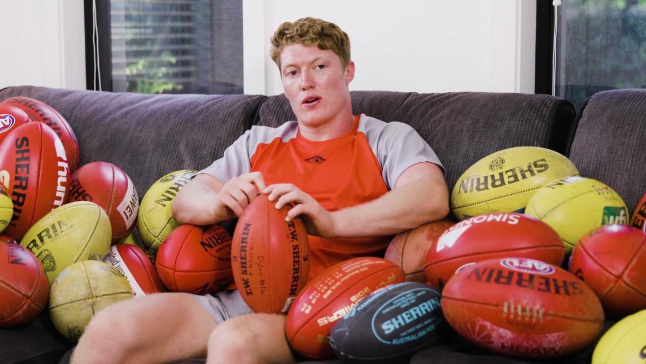Matt Rowell and his 52 Sherrin footballs.