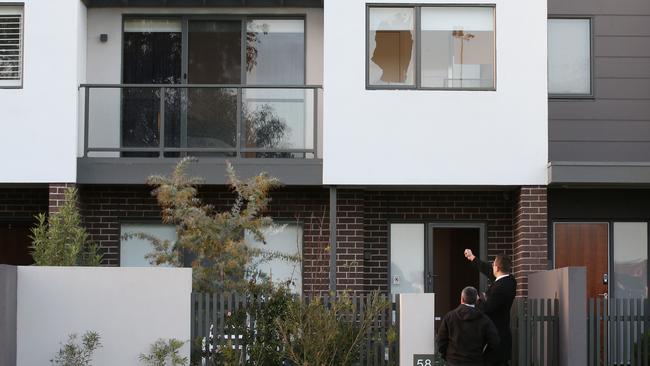 Detectives outside Mr Dank’s home. Picture: David Crosling