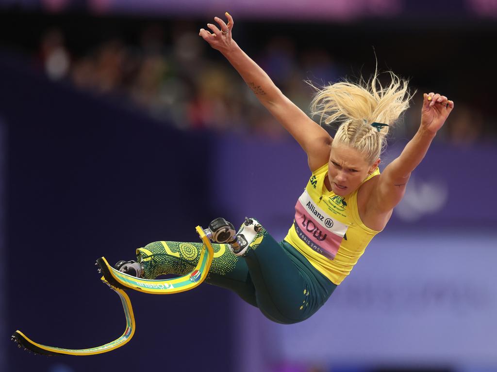 Vanessa Low of Team Australia on her way to a third straight gold medal at the women's long jump-T63 final, part of the Aussies’ big finish at the close of day eight. Picture: Ezra Shaw/Getty Image