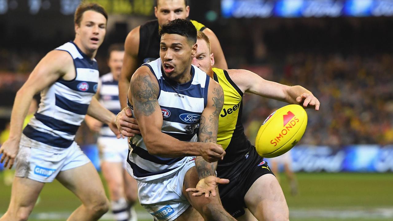 Tim Kelly fires off a handball against Richmond this season.