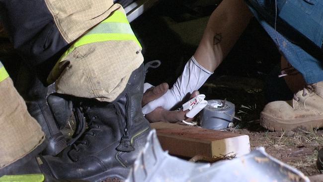 The driver was stuck in the truck after the vehicle rolled at Yatala on Thursday night Picture: SEQ News