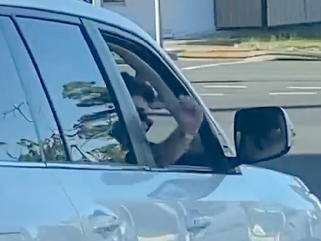 The four-wheel-driver gestures at traffic lights before the first collision. Picture: Chris Fleming