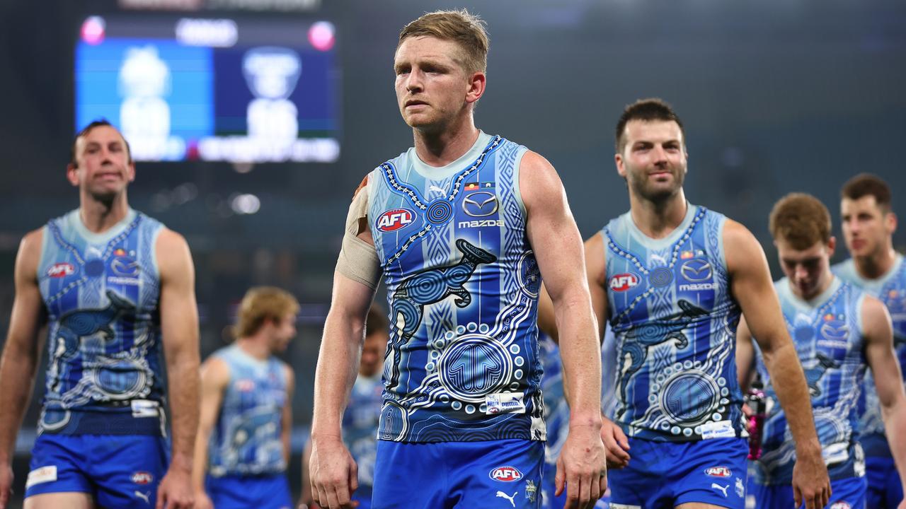 MELBOURNE, AUSTRALIA - MAY 21: Jack Ziebell of the Kangaroos (C) looks dejected following the round 10 AFL match between the North Melbourne Kangaroos and the Melbourne Demons at Marvel Stadium on May 21, 2022 in Melbourne, Australia. (Photo by Graham Denholm/Getty Images)