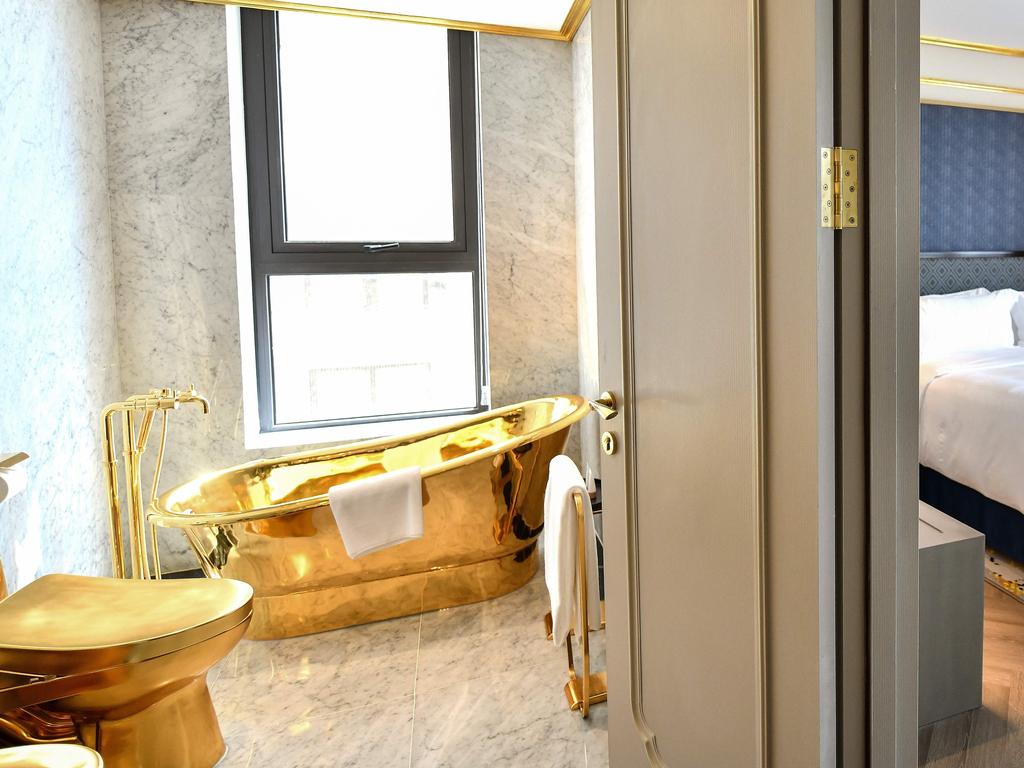 Yes, that is a gold-plated bathtub and toilet. Picture: Manan Vatsyayana/AFP