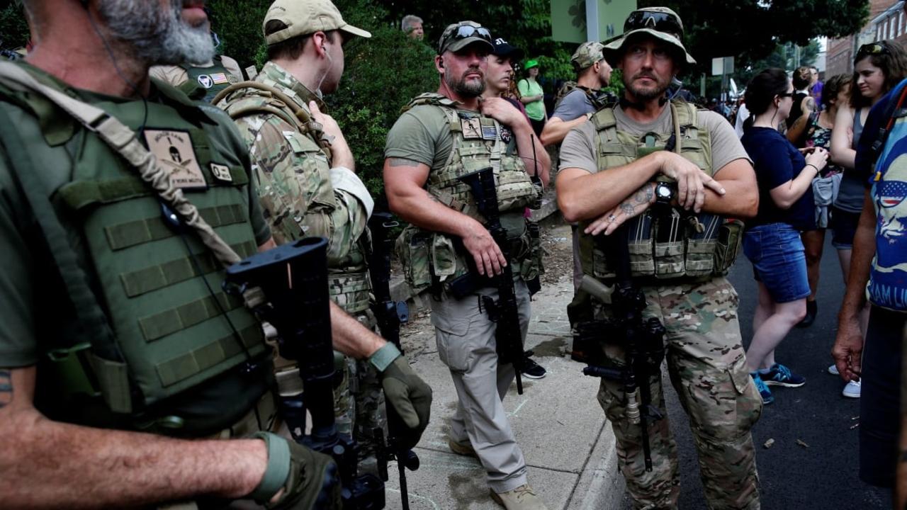 Armed groups of private citizens have increasingly been taking on a security function at public events where the possibility of violent protest exists, including at the recent Unite the Right rally in Charlottesville, Virginia. Picture: Reuters