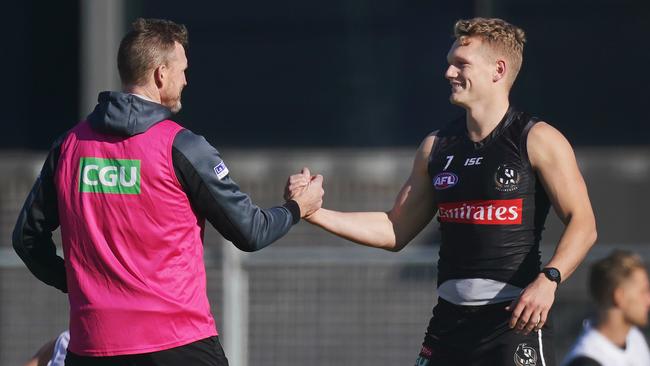 Collingwood coach Nathan Buckley and Adam Treloar at training.