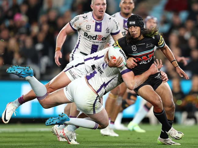 SYDNEY, AUSTRALIA - SEPTEMBER 22:  Jarome Luai of the Panthers is tackled during the NRL Preliminary Final match between the Penrith Panthers and Melbourne Storm at Accor Stadium on September 22, 2023 in Sydney, Australia. (Photo by Brendon Thorne/Getty Images)