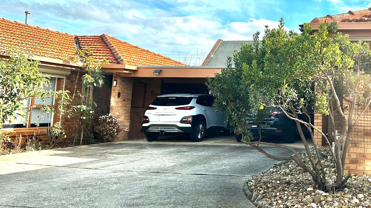 Photos taken by news.com.au shows the pavement in the garage and driveway are two different colours, unlike the original listing which suggests it's the same dark colour throughout. Picture: news.com.au