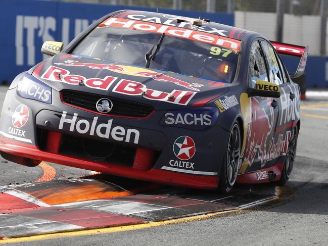 Shane van Gisbergen of Red Bull Holden Racing Team drives his Holden Commodore VF car through the street circuit in Surfers Paradise during Race 22 of the 2017 Gold Coast 600. Picture: AAP Image/Regi Varghese.