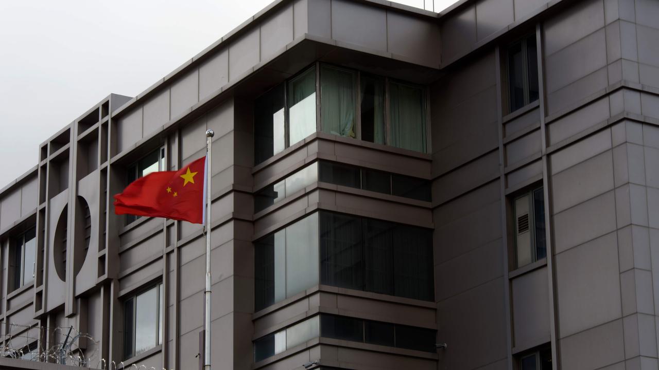 The Chinese flag flies outside of the Chinese consulate in Houston. Picture: Mark Felix / AFP.