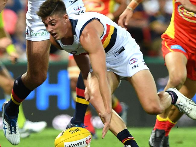 Crows player  Riley Knight gathers the ball  during the Round 5 AFL match between the Gold Coast Suns and the Adelaide Crows at Metricon Stadium in Carrara on the Gold Coast, Saturday, April 22, 2017. (AAP Image/Dave Hunt) NO ARCHIVING, EDITORIAL USE ONLY