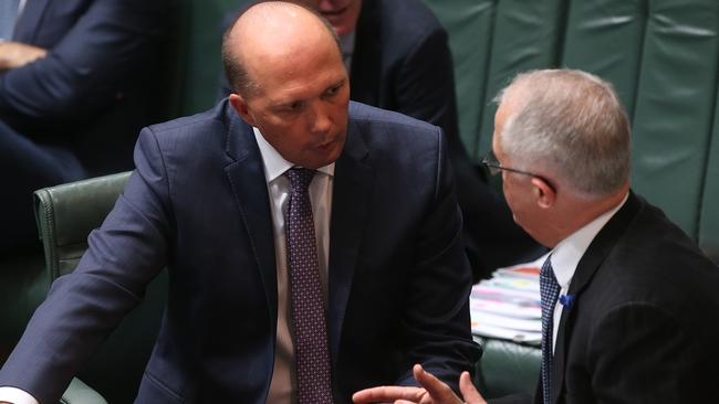 Immigration Minister Peter Dutton, left, and Malcolm Turnbull in question time on Wednesday. Picture: Kym Smith