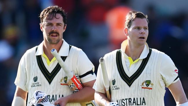 LONDON, ENGLAND - JUNE 07: Travis Head and Steven Smith of Australia walk off the field following day one of the ICC World Test Championship Final between Australia and India at The Oval on June 07, 2023 in London, England. (Photo by Gareth Copley-ICC/ICC via Getty Images)