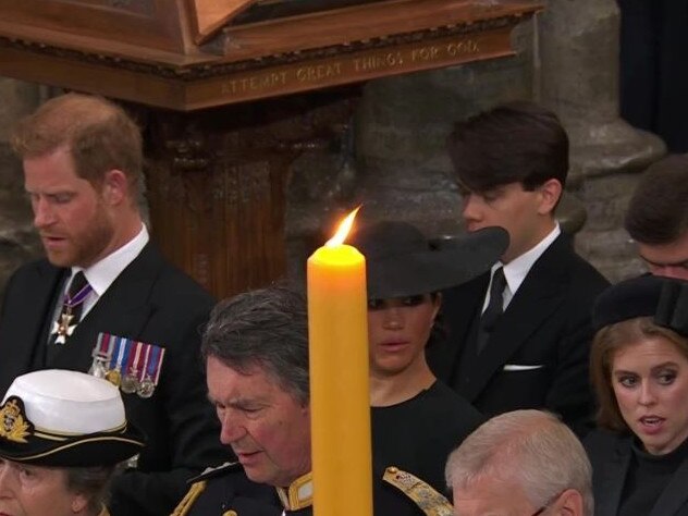 Prince Harry and Meghan Markle were seated next to Princess Beatrice.