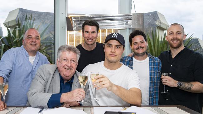 Handlin toasting the signing of chart-topping rapper Illy (centre) with Pat Handlin, VP, A & R, Australia & New Zealand (far right). Picture: Supplied.