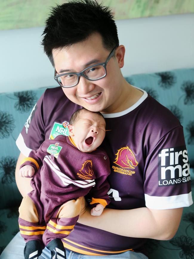 Wilfred Zee relaxes with new-born son Noah. Picture: Jono Searle