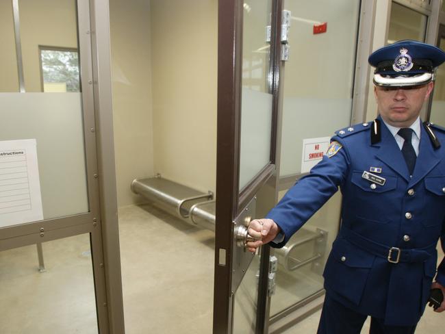 Assistant Commissioner Paul Coyne at a holding cell in Silverwater Women's Correctional Centre.