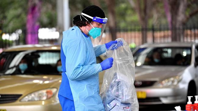 Health workers have been testing people for Covid-19 across the city. Picture: AFP