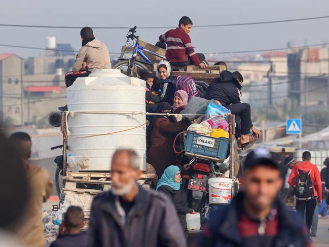 Displaced Palestinians leave a tent camp in Rafah in the southern Gaza Strip, in a truck loaded with their belongings heading to central areas of the Palestinian territory. Picture: AFP