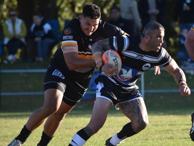 Peter Lett tries to break through a tackle. Picture: Sean Teuma/NewsLocal