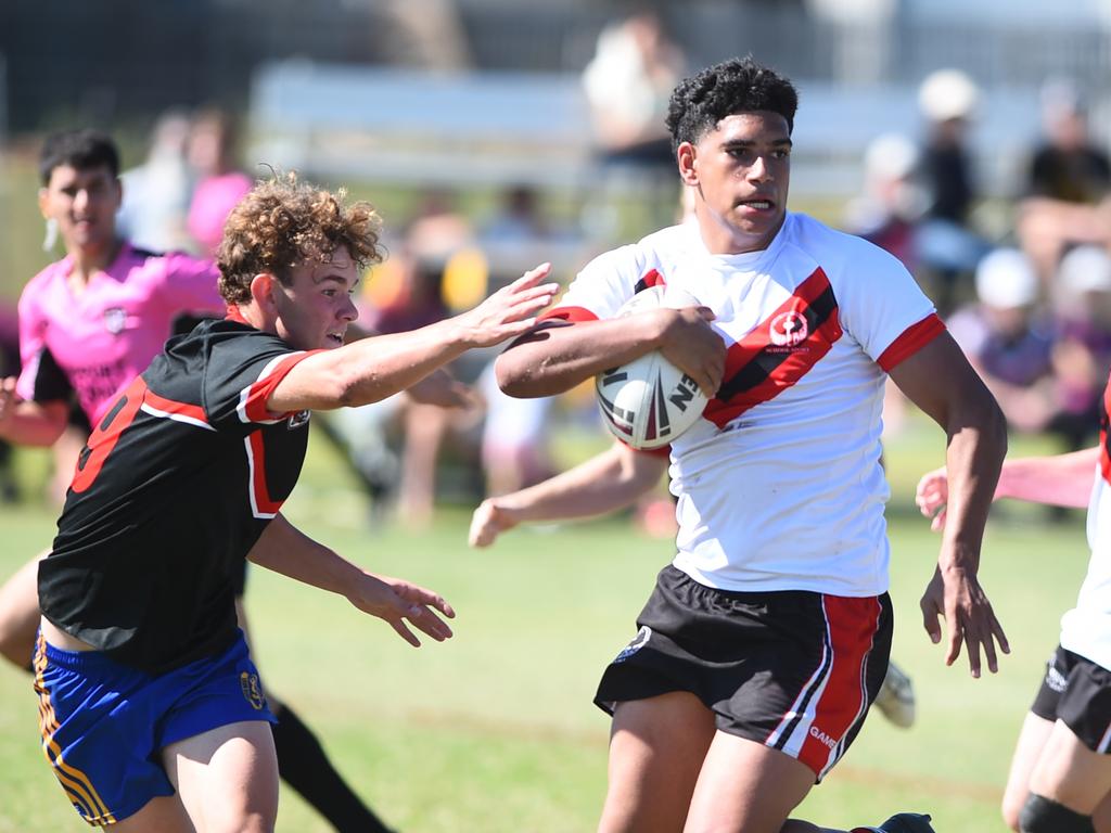 Boys Rugby League State Championship held at Northern Division, Brothers Leagues ground, Townsville. South West (black) v Wide Bay (white). 16-18 years. Noah Law of Shalom College.