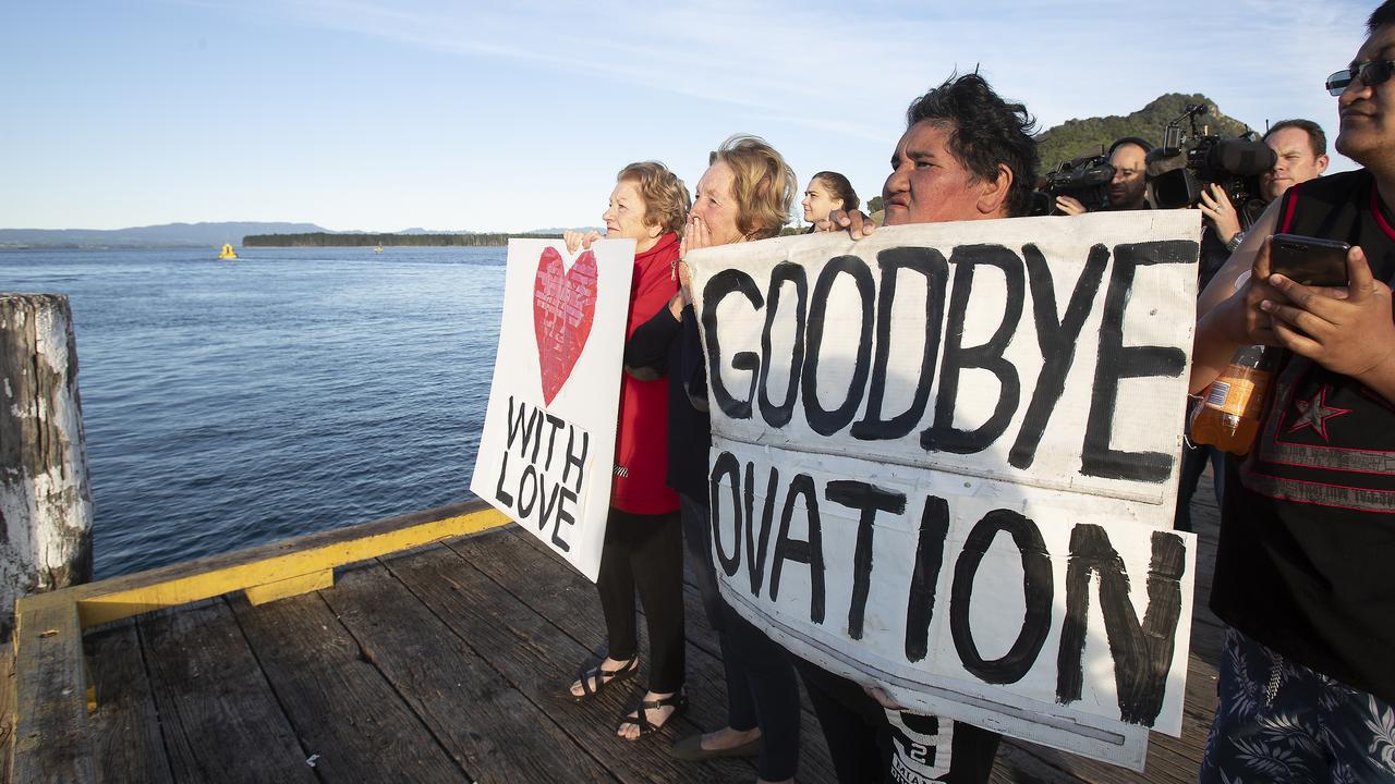 Locals brought down signs to the port to send off the cruise ship. Picture: John Boren/Getty Images.