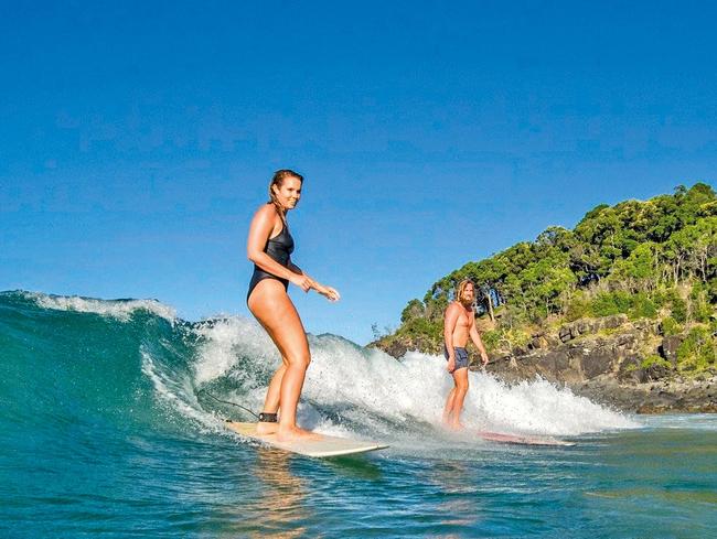 Bree Warren and her fiance Mitch McCann share a love of surfing. Picture: Supplied