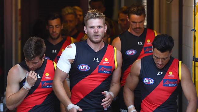 Michael Hurley leads his team out in his last match he played for the Bombers. Picture: Getty Images