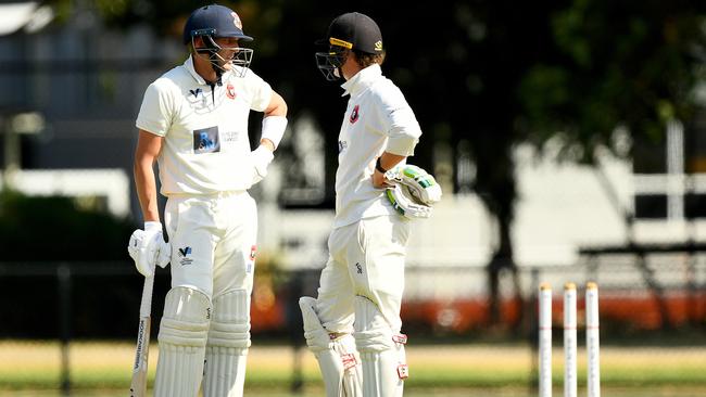 Jarrad Dowling speaks with Josh Cantrell in between overs. (Photo by Josh Chadwick)