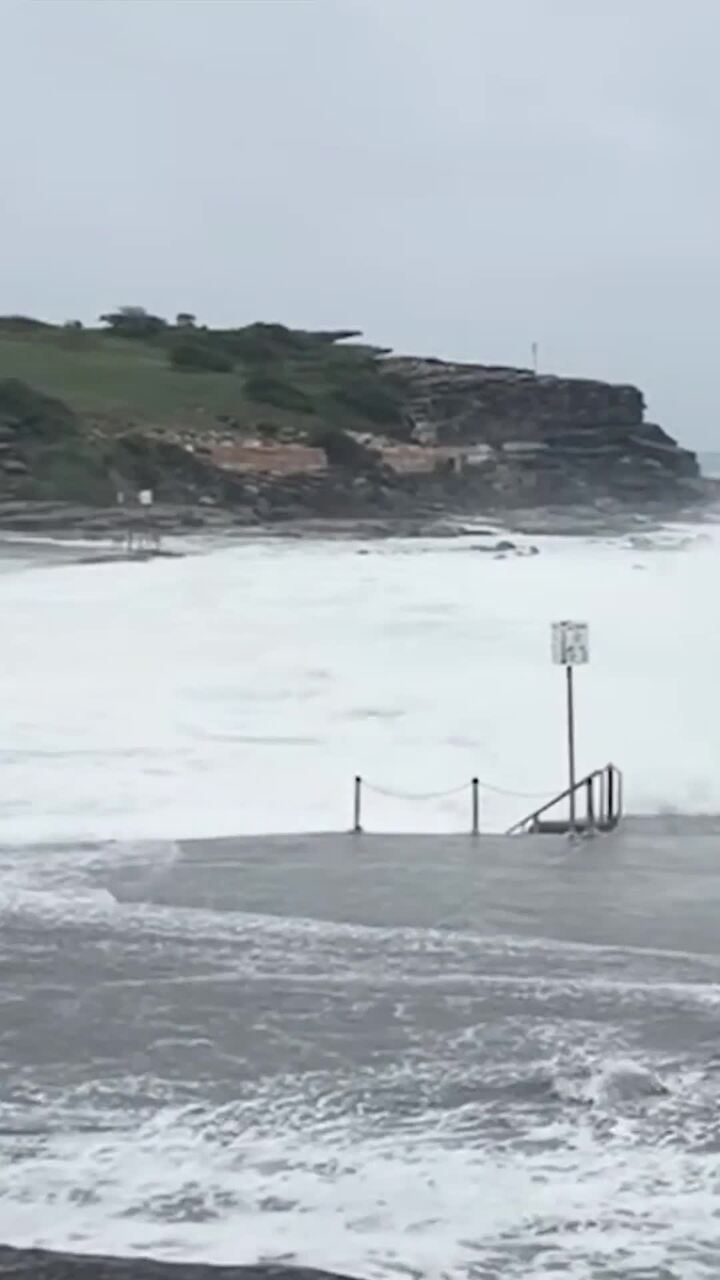 Popular beach unrecognisable in Sydney storm