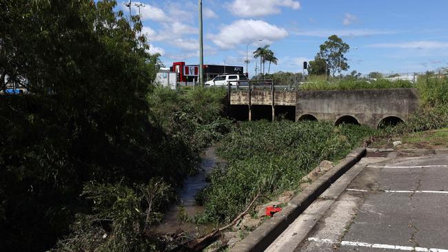 A 44-year-old woman is dead after her car was swept away in floodwaters in Aspley last night. Pics Tara Croser.