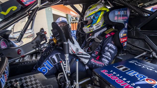 The Territory's Bryce Fullwood gets some final instructions before his first Supercars race in front of his home fans. Picture: Mark Horsburgh.