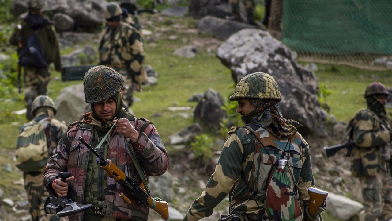 Indian Border Security Force soldiers patrolled a highway as an Indian army convoy passed through on a highway leading towards Leh, bordering China in 2020. Picture: Yawar Nazir/Getty Images