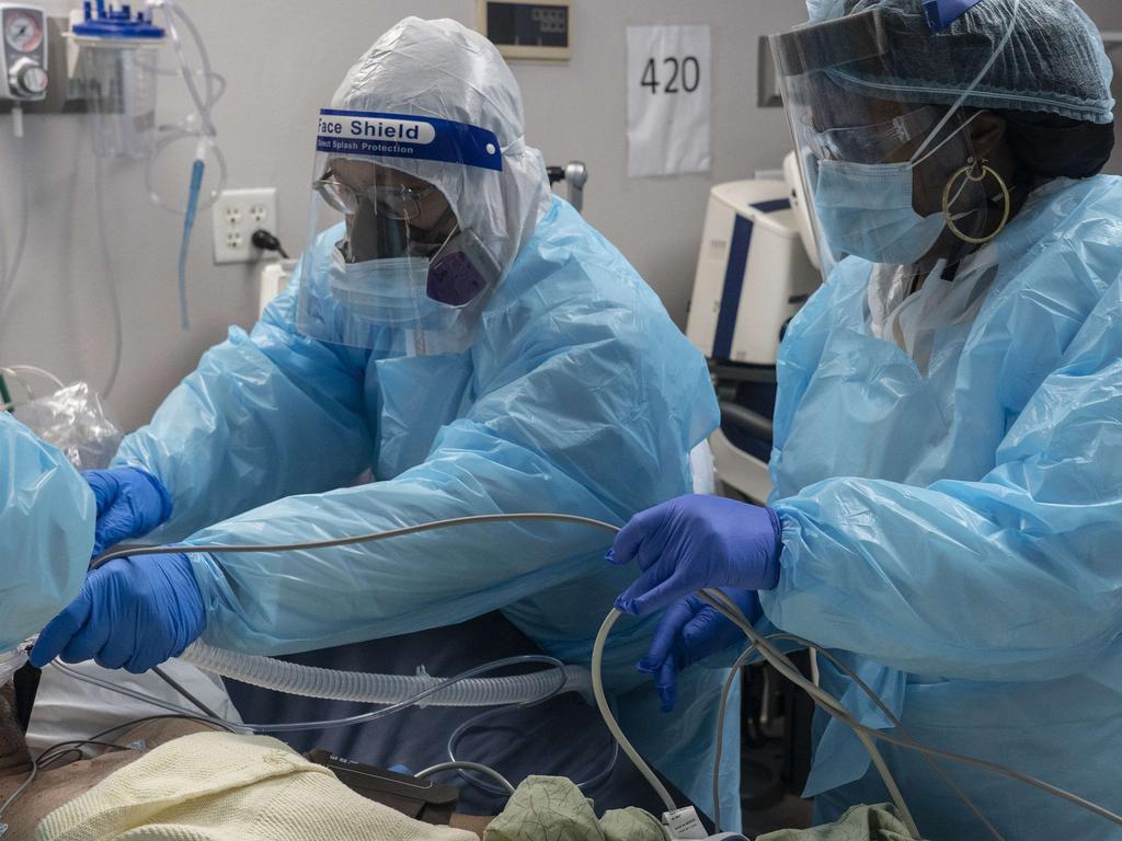 Medical staff members prepare for an intubation procedure on a patient suffering from coronavirus. Health workers in the US are getting the virus. Picture: AFP