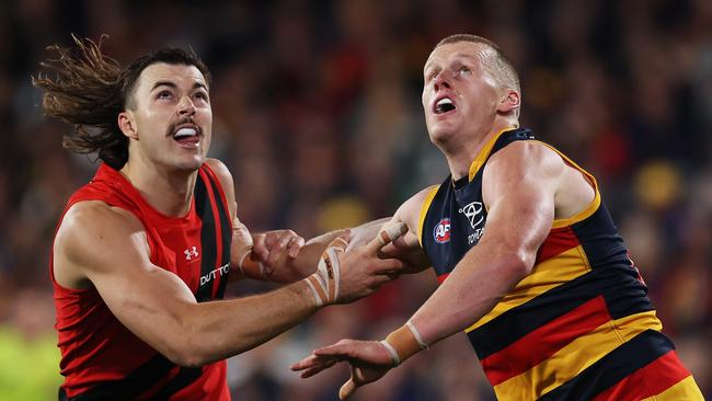 ADELAIDE, AUSTRALIA - APRIL 19: Sam Draper of the Bombers competes with Reilly O'Brien of the Crows during the 2024 AFL Round 06 match between the Adelaide Crows and the Essendon Bombers at Adelaide Oval on April 19, 2024 in Adelaide, Australia. (Photo by James Elsby/AFL Photos via Getty Images)