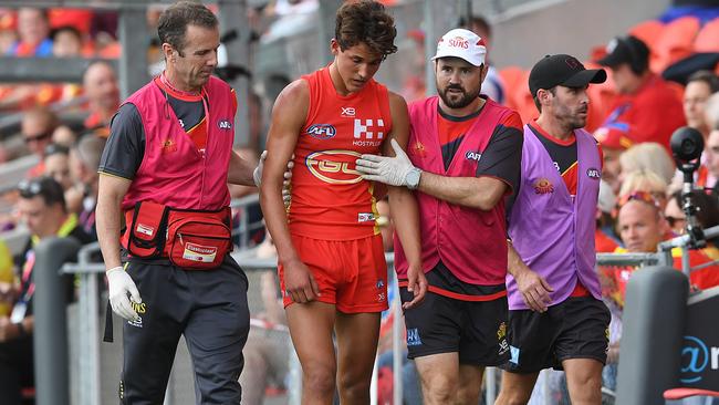 Will Powell is taken from the field with concussion at Metricon Stadium in 2019.