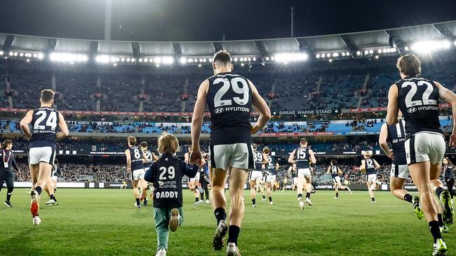 MELBOURNE, AUSTRALIA - JULY 28: George Hewett of the Blues enters the field during the 2023 AFL Round 20 match between the Collingwood Magpies and the Carlton Blues at The Melbourne Cricket Ground on July 28, 2023 in Melbourne, Australia. (Photo by Dylan Burns/AFL Photos via Getty Images)