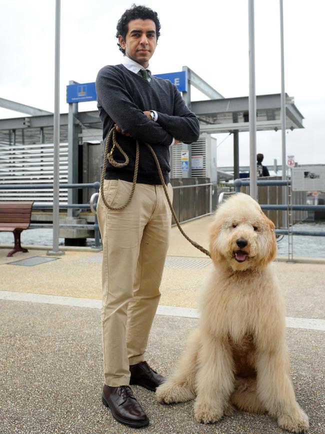 Teneriffe resident Alex Chaudhuri and his dog Floyd are upset that Floyd can't travel of the ferries. Photo: Paul Guy