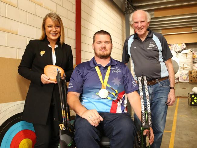 Hills Shire Mayor Yvonne Keane with Australian Paralympic bronze medalist Jonathon Milne and Abbey Archery owner Tony Moussa.