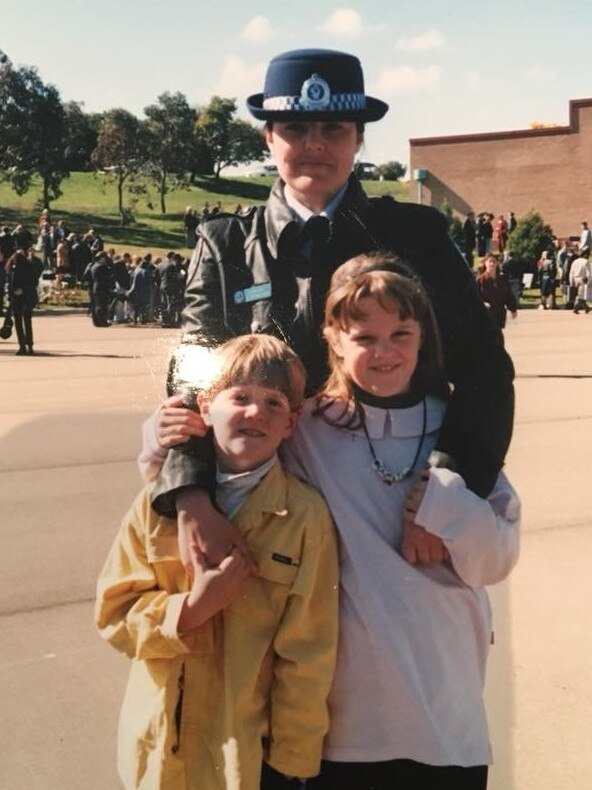 Victoria Beresford pictured with her best friend’s children after graduating from Goulburn Police Academy in August 1988.