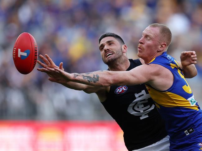 Marc Pittonet of the Blues battles with Bailey J. Williams in the ruck. Picture: Will Russell/AFL Photos via Getty Images.